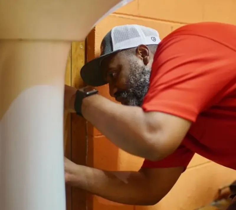 A-Total Plumbing Technician Fixing Sink