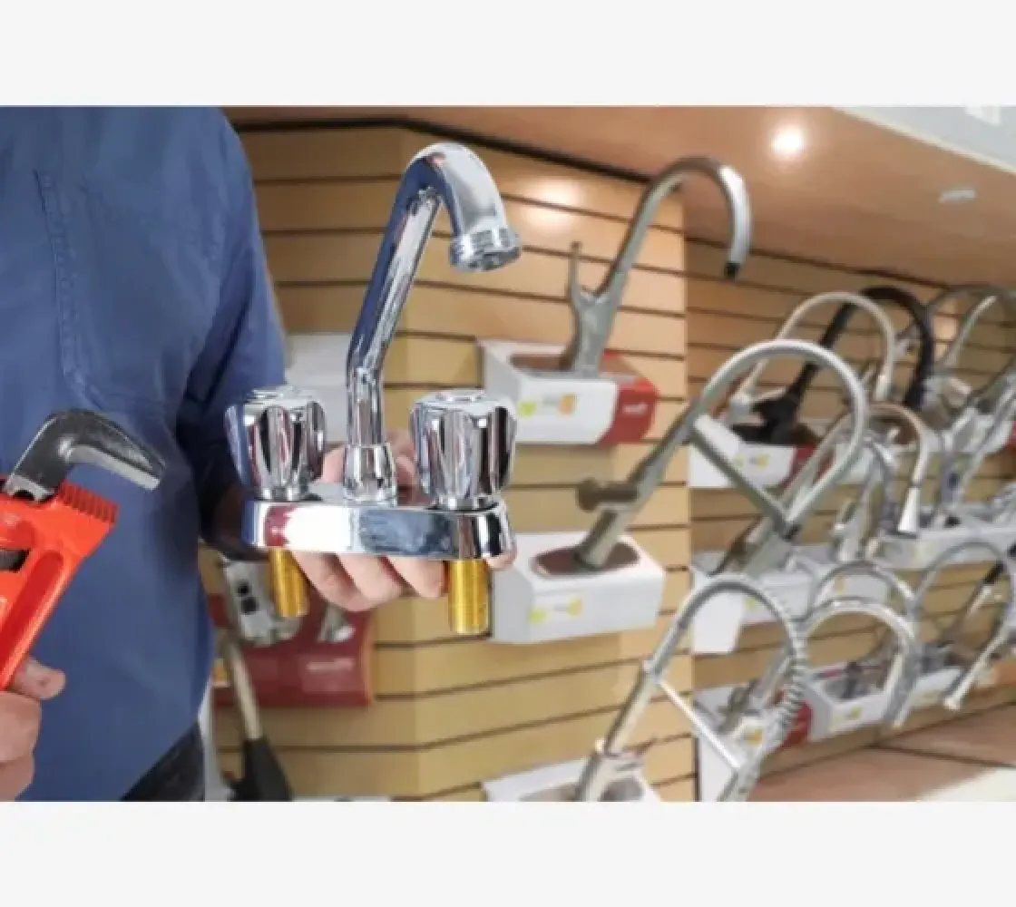 a person holding a faucet
