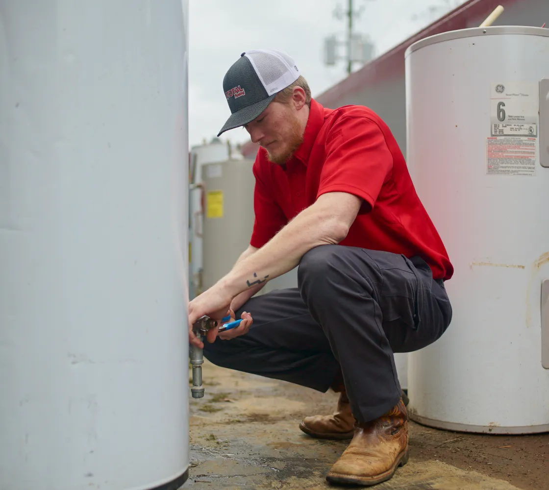 Plumbing Expert Servicing Water Heater in Cartersville