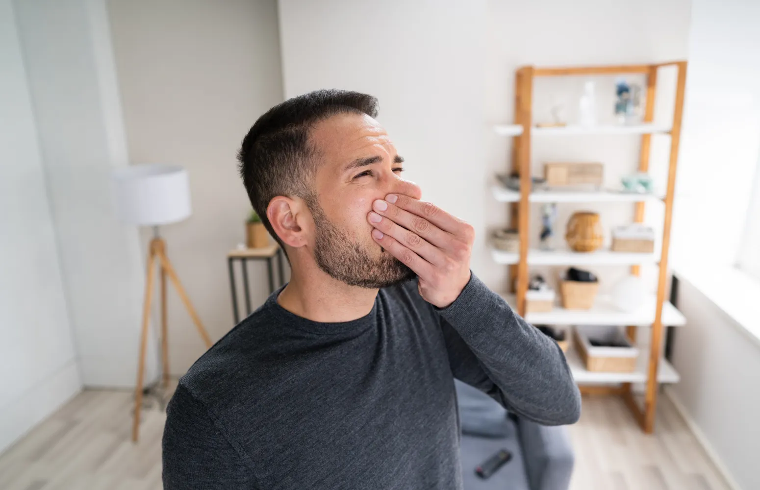 a man pinching his nose