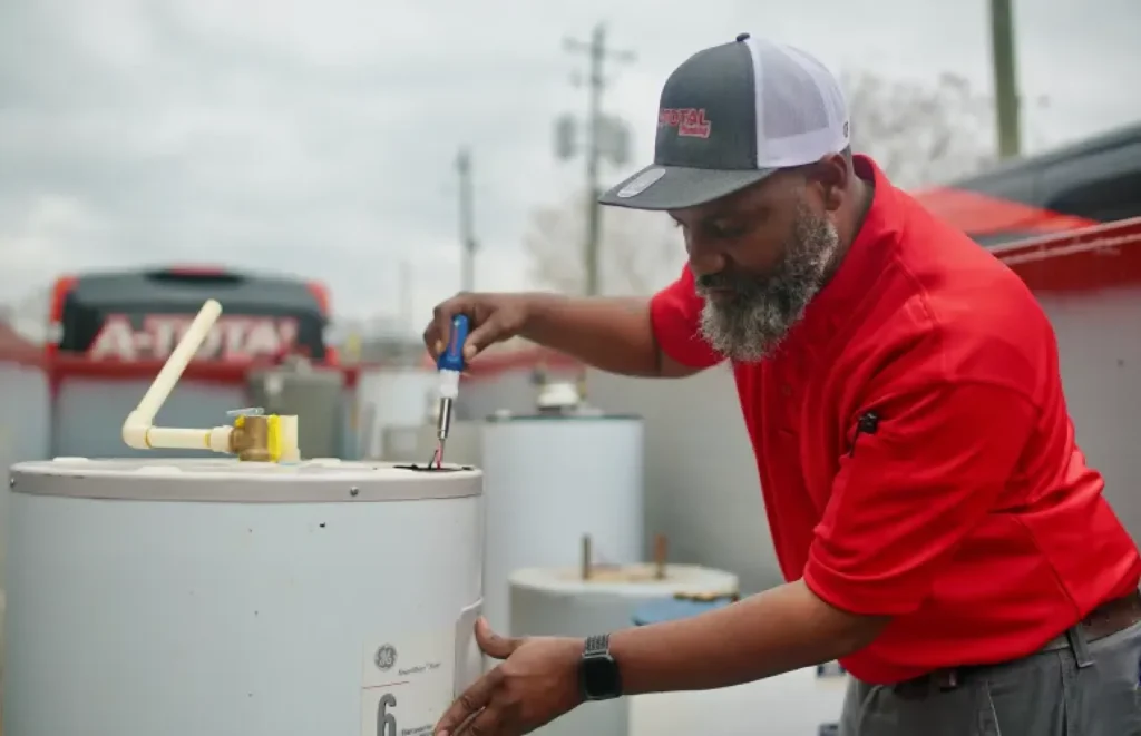 Plumber working on a water heater